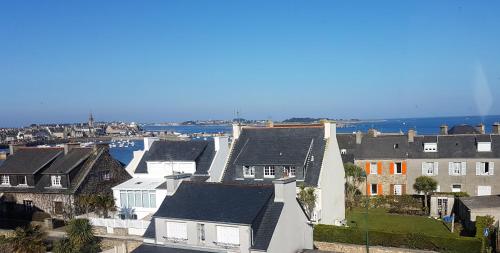 an aerial view of a town with houses and the water at Roscoff Les Duons in Roscoff