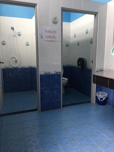 a bathroom with a shower and a toilet at Khaohom House in Chiang Mai