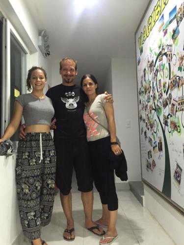 a man and two women standing next to each other at Vagibi Hotel in Dong Hoi