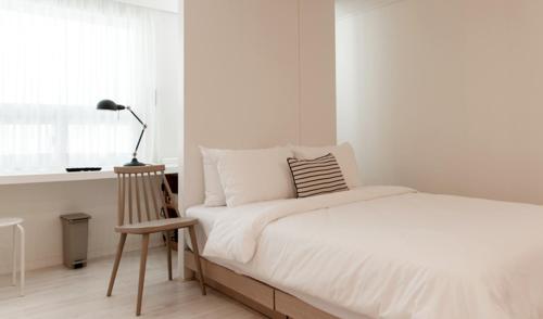 Postel nebo postele na pokoji v ubytování Hotel Kyungsung