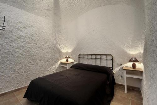 Postel nebo postele na pokoji v ubytování Cueva Solano