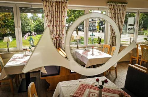 a mirror in the dining room of a restaurant at Landhotel Gasthof zur Post in Winterberg