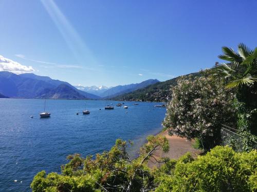 a large body of water with boats in it at Hotel Belvedere San Gottardo by LVG Hotel Collection in Verbania