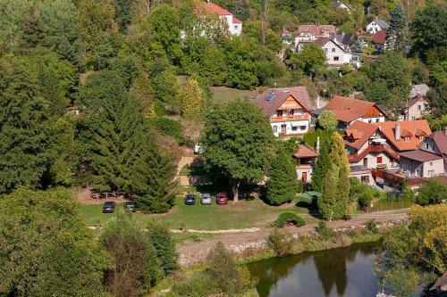 an aerial view of a village with a river and houses at Penzion Na Hradčanech in Nové Město nad Metují