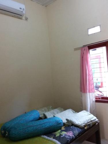 Postel nebo postele na pokoji v ubytování Rome Residence Sibolga Pandan