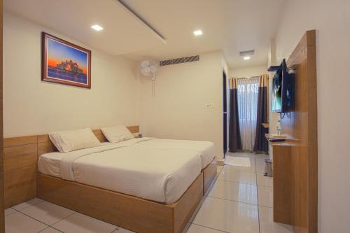 Posteľ alebo postele v izbe v ubytovaní SAAS Residency