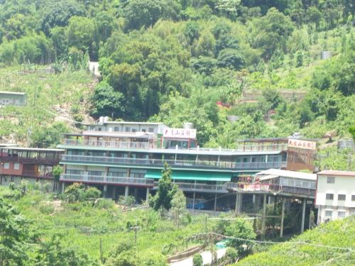 a building on the side of a hill at King Villa in Heping