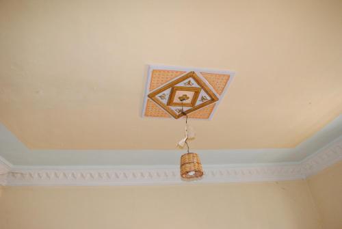a kite hanging from the ceiling of a room at Auberge Restaurant Rooftop Tamazirt in Boumalne