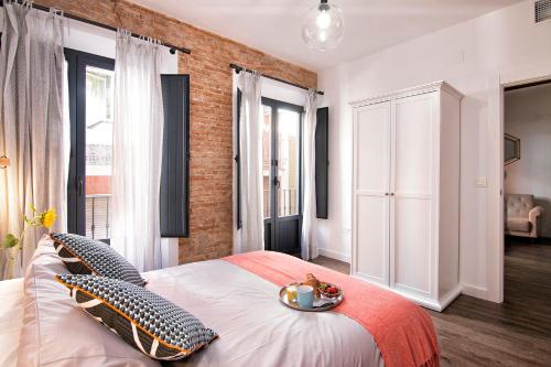 Ein Bett oder Betten in einem Zimmer der Unterkunft Chezmoihomes Sweet & Trendy nest in Granada Center for 6