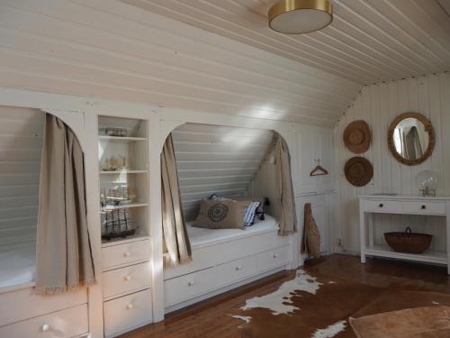 a room with a bed in the corner of a room at Elins Lycka i Viken in Viken