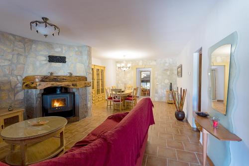 a living room with a couch and a fireplace at Marasolana in Jalón