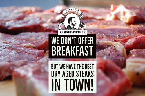 a sign that says we dont offer breakfast but we have the best dry aged at Zum Scheffelhof in Maulbronn