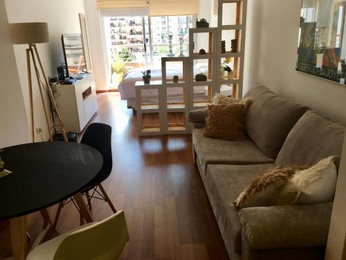 a living room with a couch and a table at 629 Serrano in Buenos Aires
