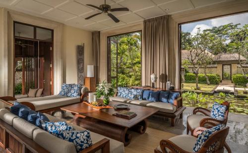a living room with couches and a table at Four Seasons Resort Bali at Jimbaran Bay in Jimbaran