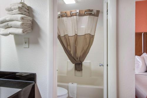 a bathroom with a shower and a toilet and a sink at Motel 6-Van Buren, AR I- 40 in Van Buren