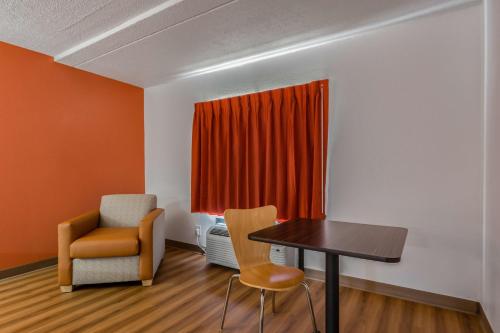 a room with a table and two chairs and a window at Motel 6-White, GA - Cartersville in White