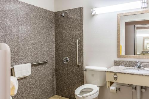 a bathroom with a toilet and a sink and a shower at Motel 6-Petersburg, VA - Fort Lee in Petersburg