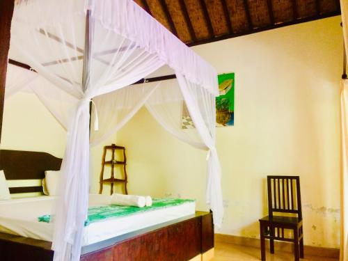 Katil atau katil-katil dalam bilik di Lakromo Amed Homestay