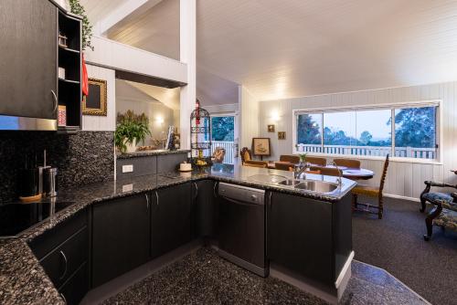 a kitchen with a sink and a counter top at Land Of Lost Treasure in Maleny