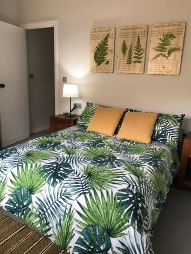 a bedroom with a bed with plants on it at Campello Mistral in El Campello