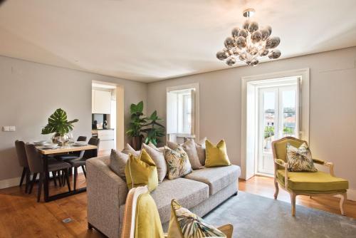 a living room with a couch and a table at Lisbon Finestay Mastro Apartments in Lisbon