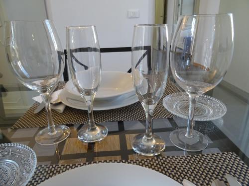 a group of wine glasses sitting on a table at CharmeRooms Villa Moroni in Stezzano