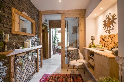 a home office with a stone wall at Landhaus Dengg in Gerlos