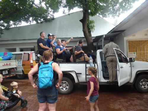 a group of people standing in the back of a truck at Fawlty Towers Accommodation & Activities in Livingstone