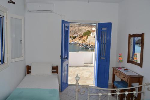 Postel nebo postele na pokoji v ubytování Ammos Holiday House