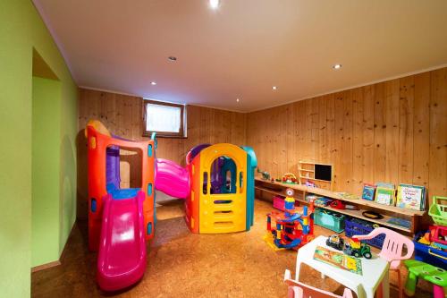 a childs room with a play room with play equipment at Haus Christophorus in Mariapfarr