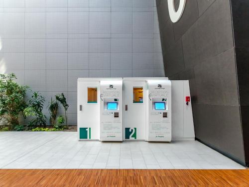 three gas machines are lined up in a room at Resting Pods - ZzzleepandGo BGH Bergamo Hospital in Bergamo