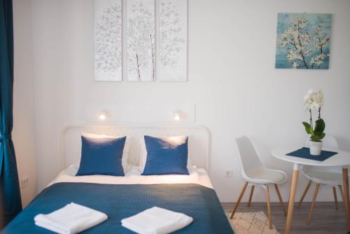 Posteľ alebo postele v izbe v ubytovaní Rába Apartman House