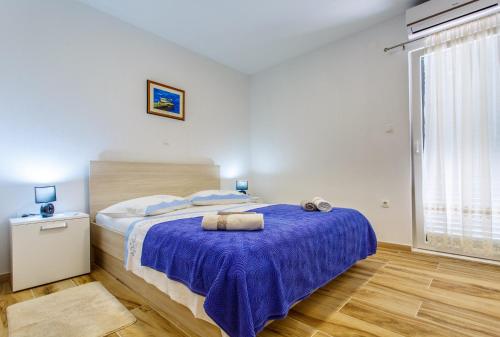 Postel nebo postele na pokoji v ubytování Apartments Franičević