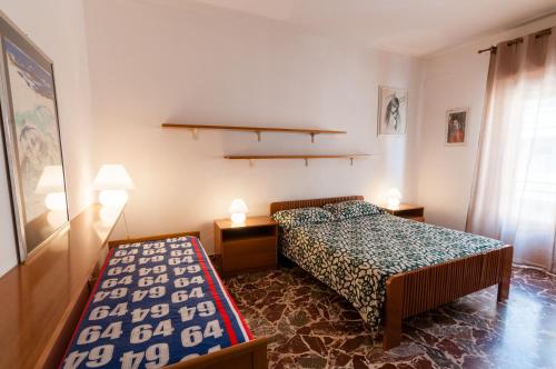 Ένα ή περισσότερα κρεβάτια σε δωμάτιο στο La casa sulla spiaggia