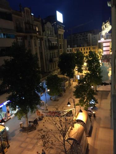 a view of a city street at night at ARSS Apartment Skopje Main Square in Skopje
