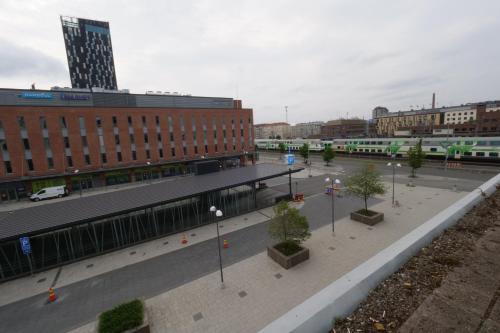 a city street with a train station and buildings at Hotel Citi Inn in Tampere