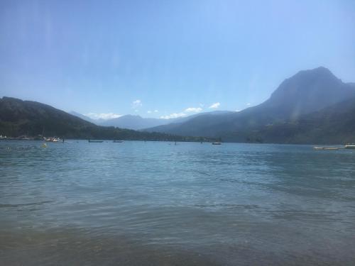 a large body of water with mountains in the background at Studio Chez Mary in Chorges