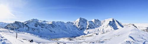 a snowy mountain range with snow covered mountains at Bed & Breakfast Hostel Nives in Solda