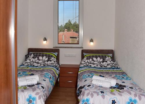 Katil atau katil-katil dalam bilik di Comfort Apartment