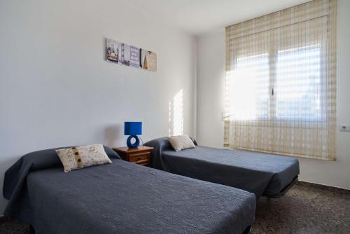 Postel nebo postele na pokoji v ubytování Manresa Apartamentos Turísticos