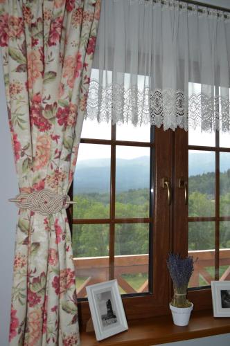 a window with a view of a mountain at Uroczysko starych sztolni in Szklarska Poręba