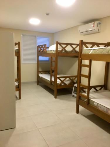 a room with bunk beds in a dorm at Tapera Hostel in Sao Paulo