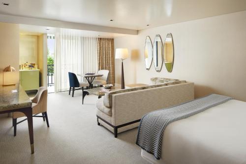 a hotel room with a bed and a desk at The London West Hollywood at Beverly Hills in Los Angeles