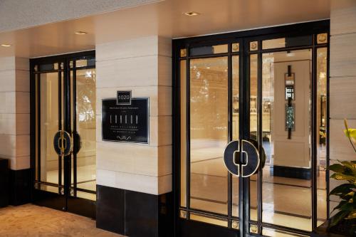 a store front with revolving doors in a building at The London West Hollywood at Beverly Hills in Los Angeles