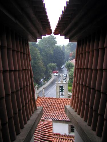a view of a street from a window of a building at Hotel Central Jardim in Geres