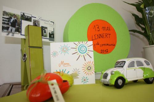 a toy car sitting on a table with a birthday card at Hotel Gasthof Kapelhof in Erpe-Mere