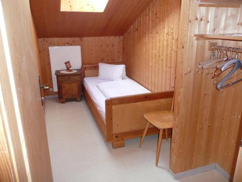 a small room with a bed and a table at Haus Eberhard in Vent