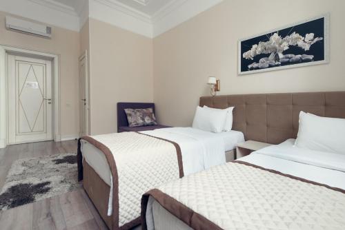 Кровать или кровати в номере Hotel Park Avenue