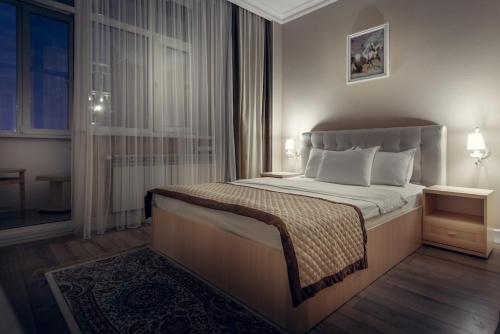 Кровать или кровати в номере Hotel Park Avenue