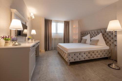 Ένα ή περισσότερα κρεβάτια σε δωμάτιο στο Hotel Casa Fiori